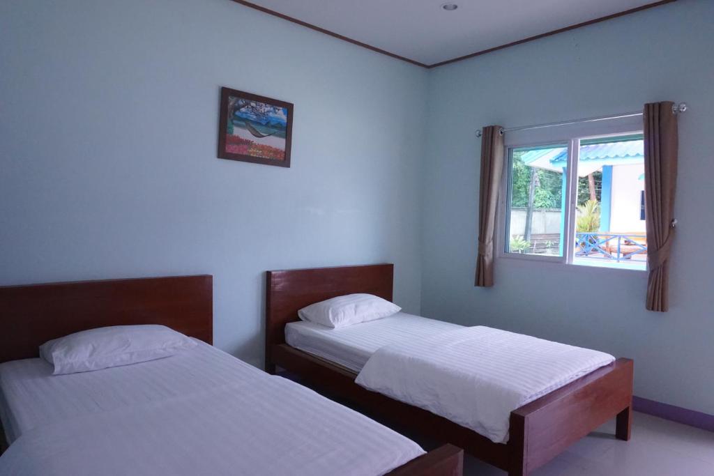 Postel nebo postele na pokoji v ubytování Anyamanee Resort Trat