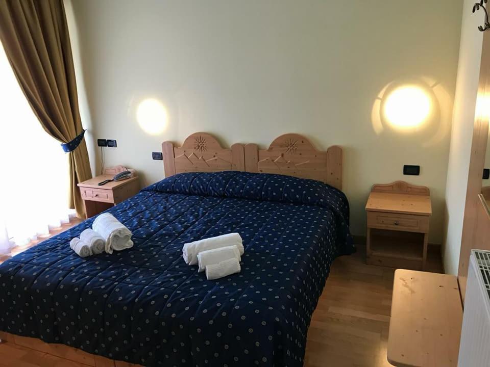 Postel nebo postele na pokoji v ubytování Hotel Sole del Baldo