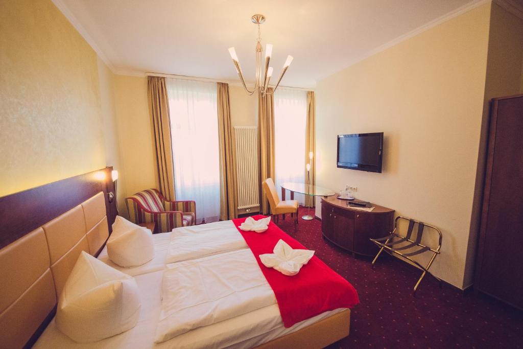 TV a/nebo společenská místnost v ubytování Hotel Arena City