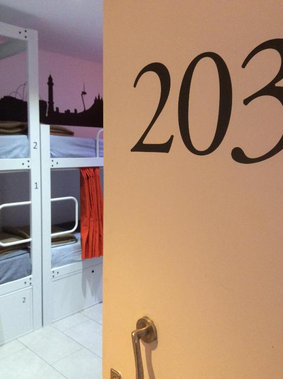 Postel nebo postele na pokoji v ubytování Hostelscat