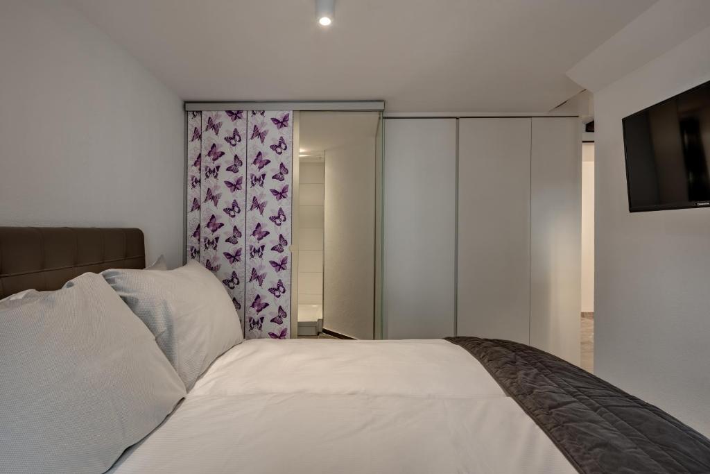 Postel nebo postele na pokoji v ubytování smartroom The Residence la Cittadella Baden
