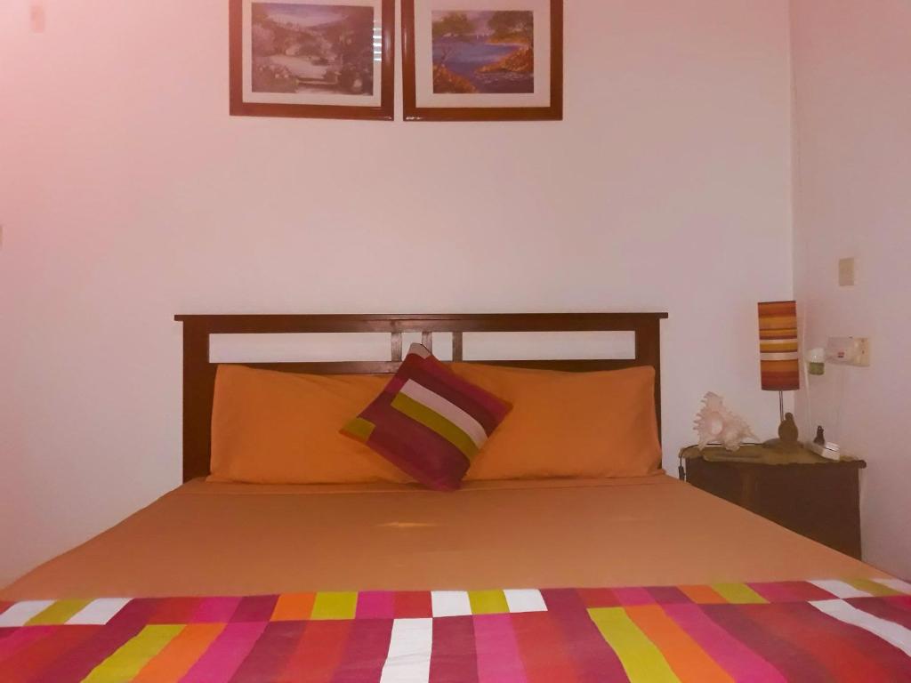 Postel nebo postele na pokoji v ubytování Flo Villa