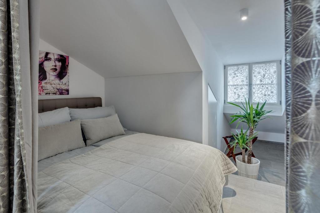Postel nebo postele na pokoji v ubytování smartroom The Residence la Cittadella Baden