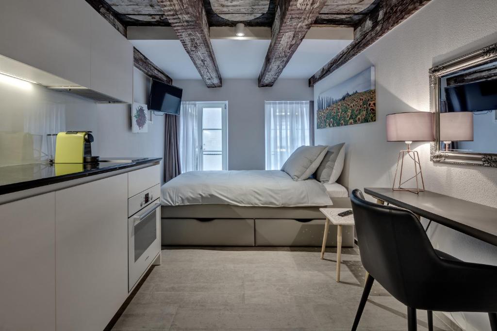Kuchyň nebo kuchyňský kout v ubytování smartroom The Residence la Cittadella Baden