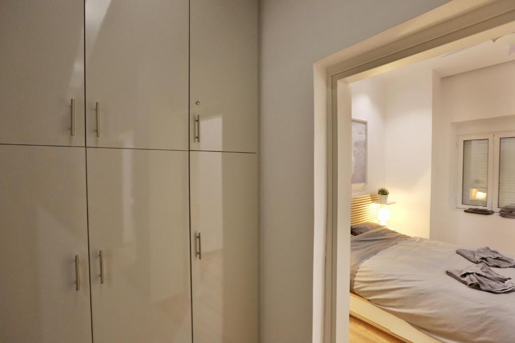 Łóżko lub łóżka w pokoju w obiekcie Luxury Apartment near Acropolis