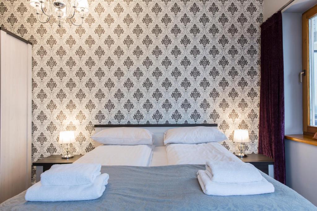 Posteľ alebo postele v izbe v ubytovaní udanypobyt Apartamenty Orkana Park Centrum