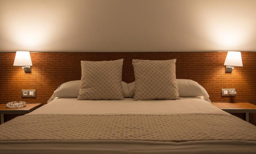 Cama o camas de una habitación en Carlos III