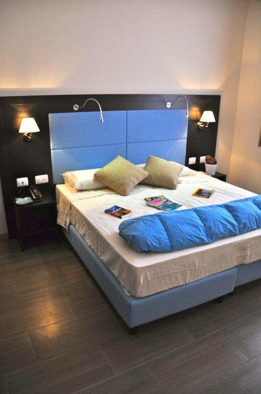 Postel nebo postele na pokoji v ubytování Hotel 325 Tor Vergata