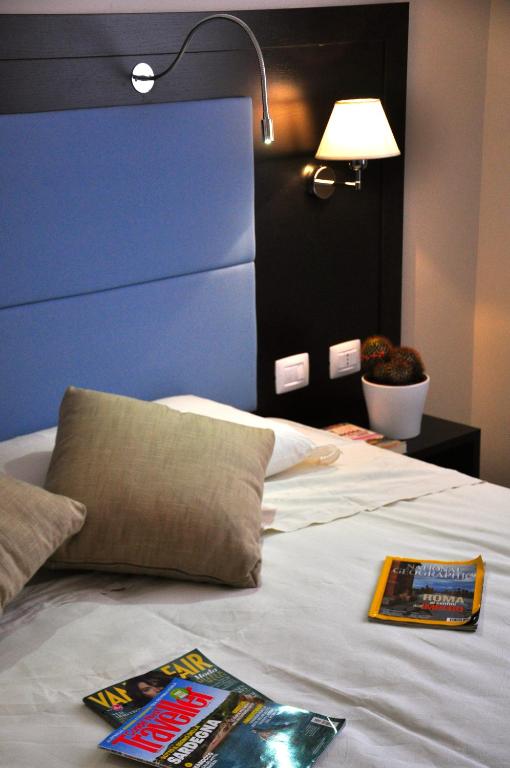 Postel nebo postele na pokoji v ubytování Hotel 325 Tor Vergata