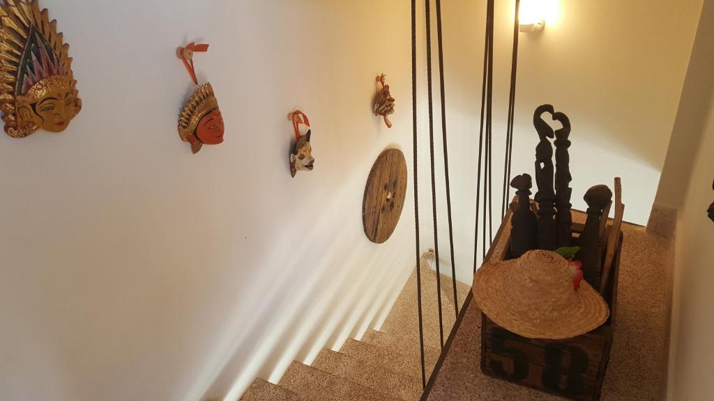 a stairway with a mirror and a staircase with some wall decorations at Dar d'Art in Marrakesh