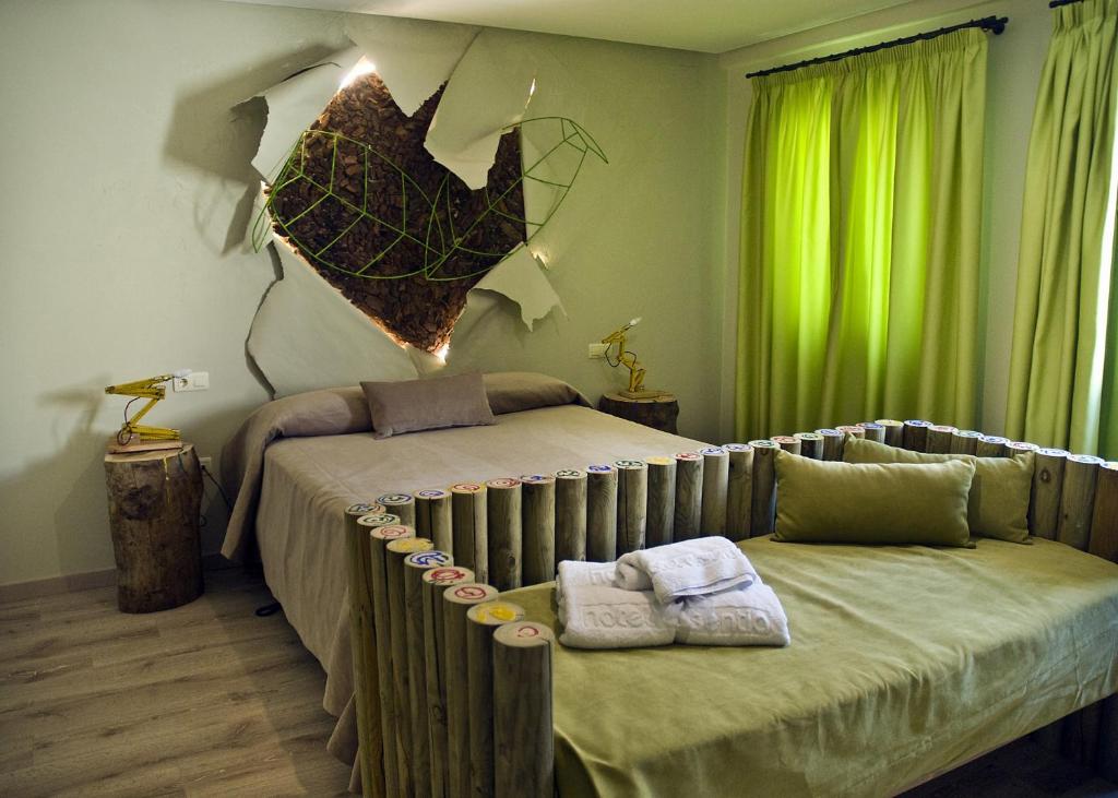 Posteľ alebo postele v izbe v ubytovaní Hotel Galería Essentia