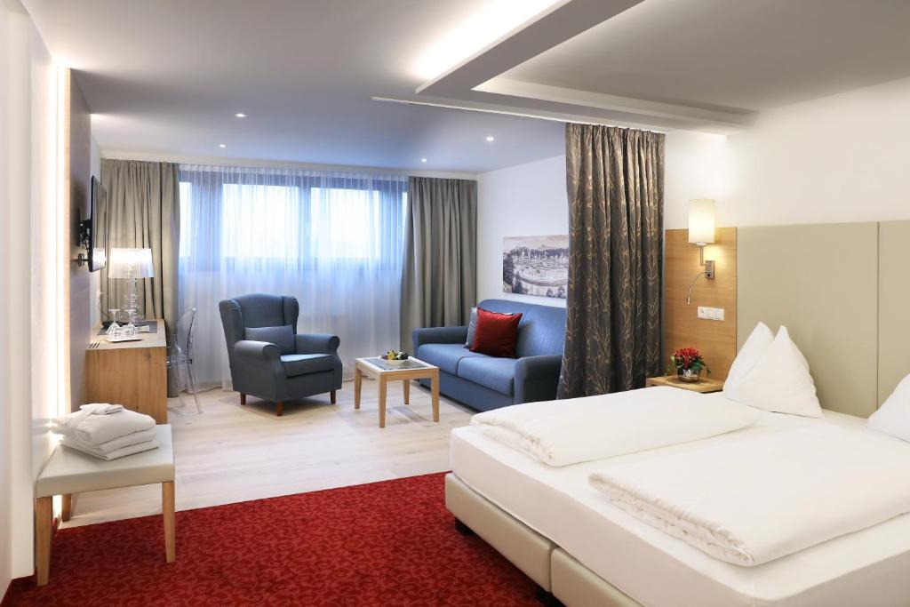 Postel nebo postele na pokoji v ubytování Hotel Hubertushof