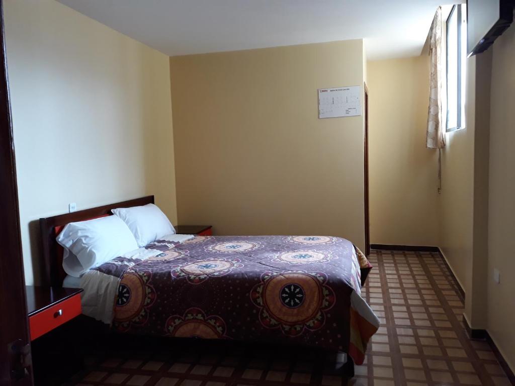 Postel nebo postele na pokoji v ubytování Hotel Navarra