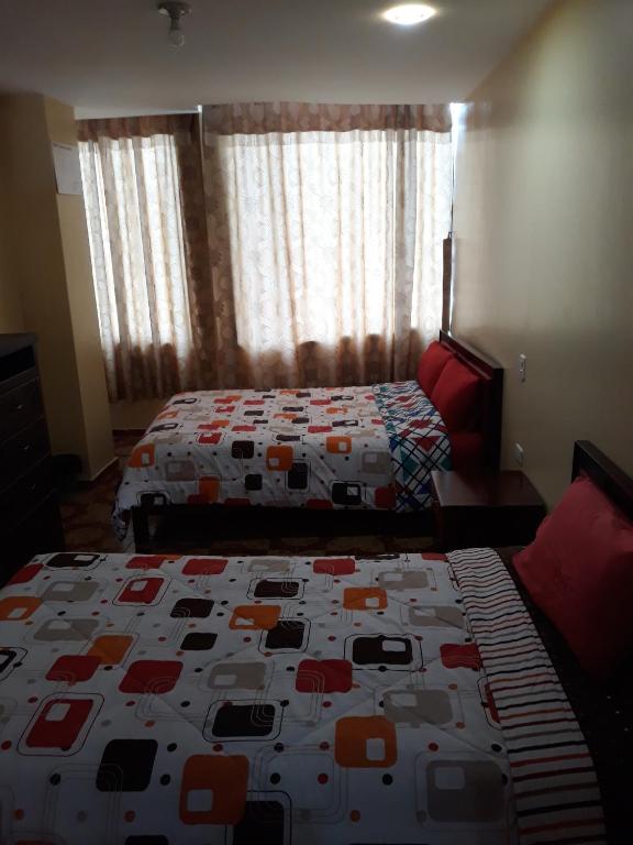 Postel nebo postele na pokoji v ubytování Hotel Navarra