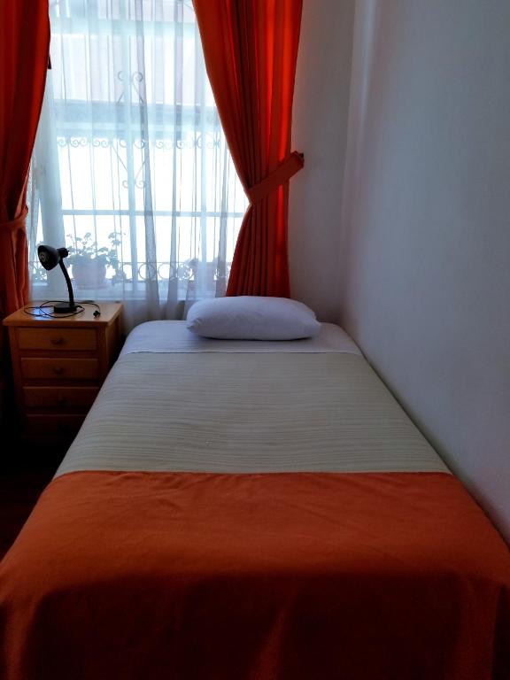 Postel nebo postele na pokoji v ubytování Heritage Inn