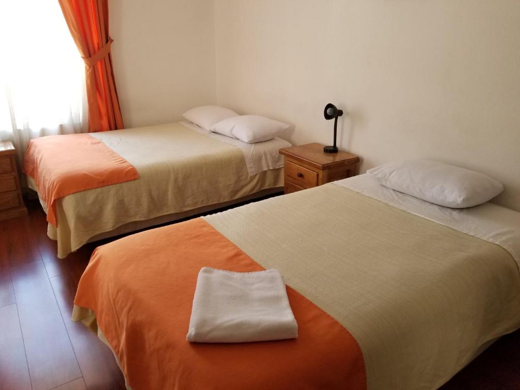 Postel nebo postele na pokoji v ubytování Heritage Inn