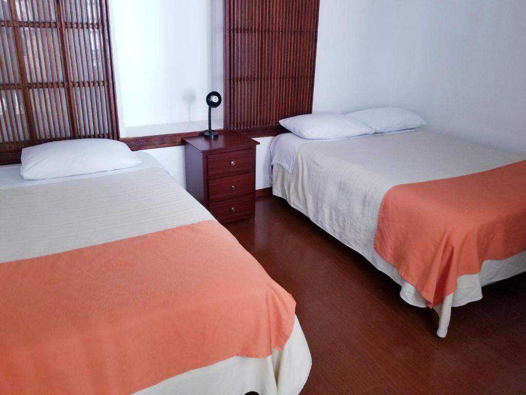 Postel nebo postele na pokoji v ubytování Heritage Inn