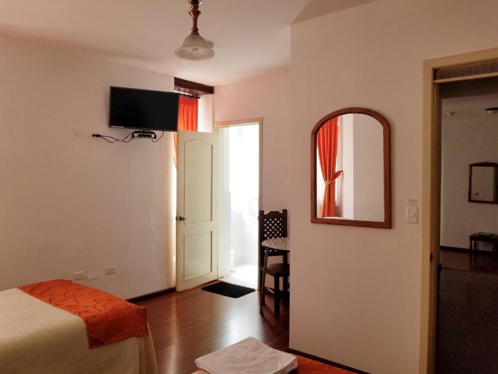 Postel nebo postele na pokoji v ubytování Heritage Inn
