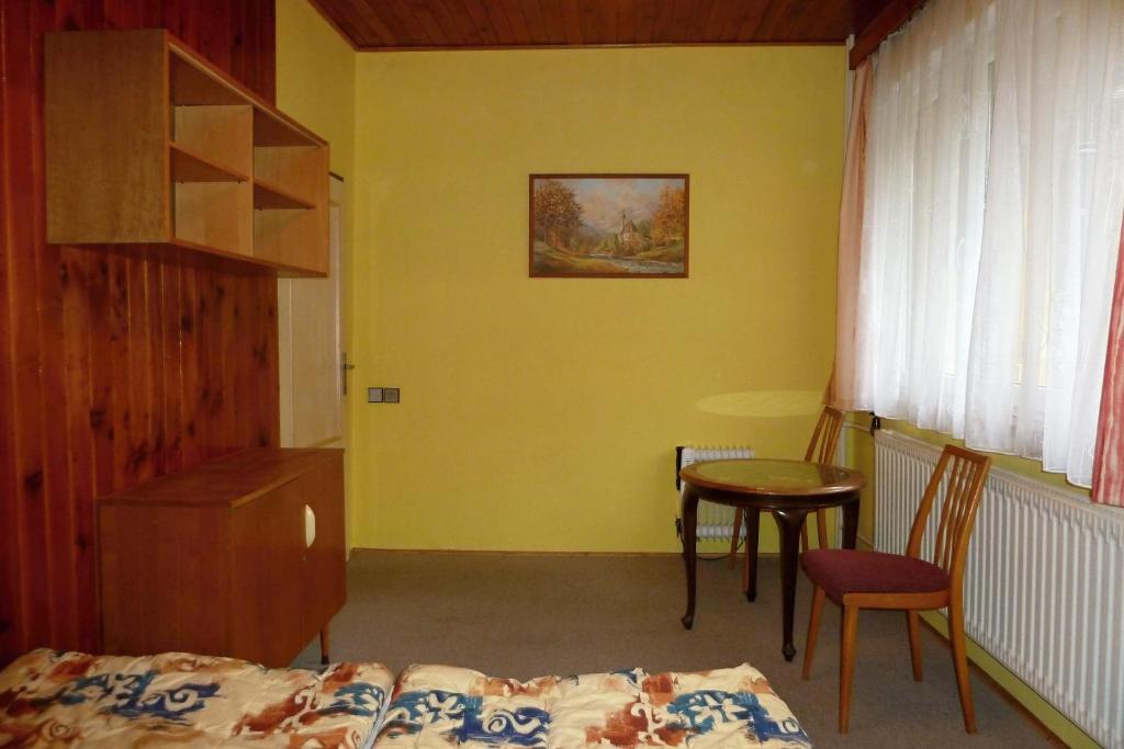 Postel nebo postele na pokoji v ubytování Pod Sněžníkem