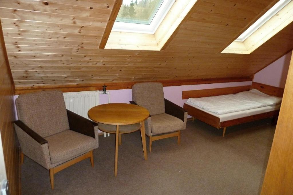 Postel nebo postele na pokoji v ubytování Pod Sněžníkem