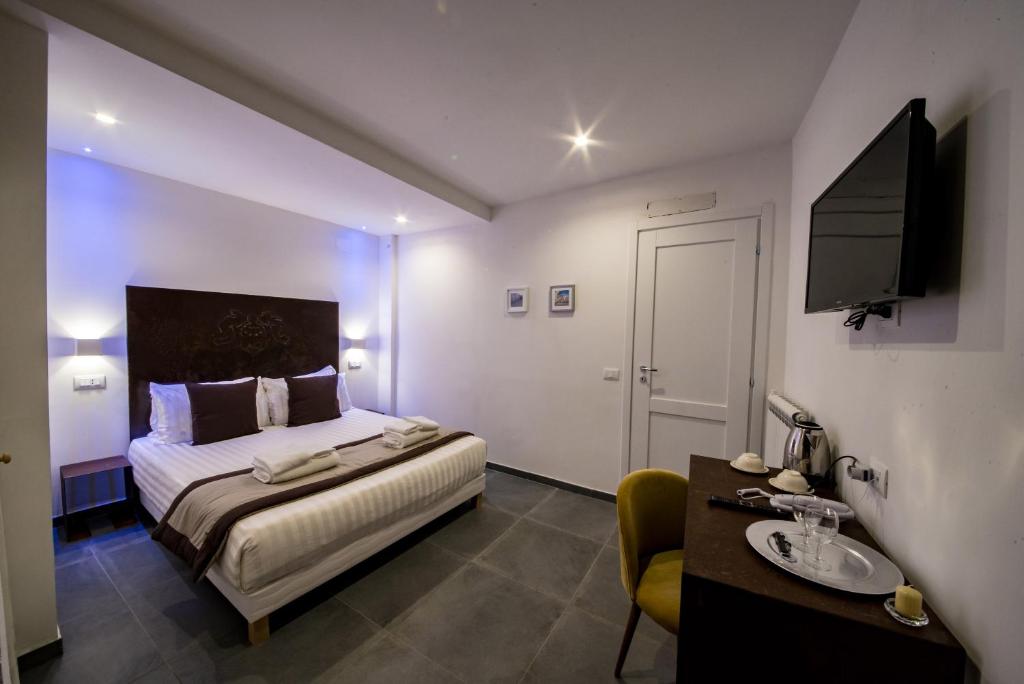 Postel nebo postele na pokoji v ubytování Hotel Assisivm Antica Dimora AD