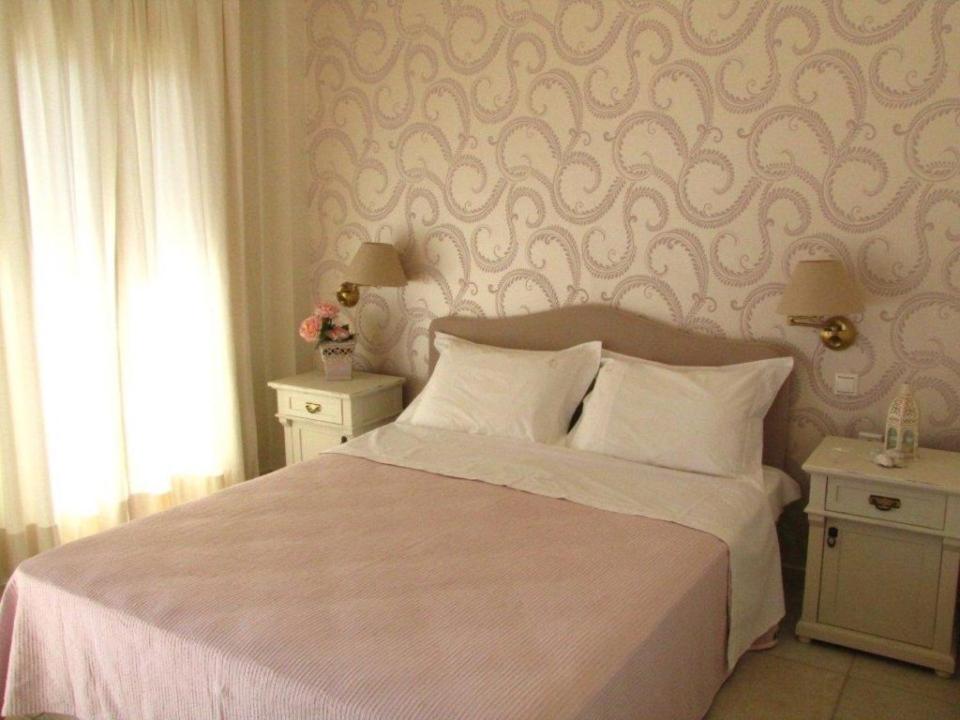 Postel nebo postele na pokoji v ubytování Almyra Hotel