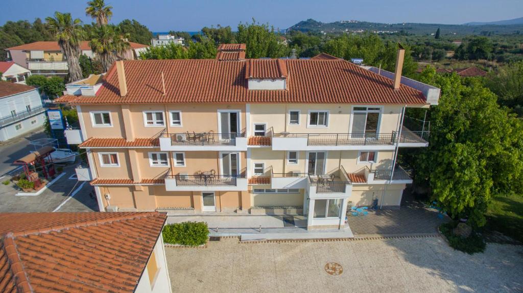 an aerial view of a house with a red roof at Rooms Nancy in Agios Andreas
