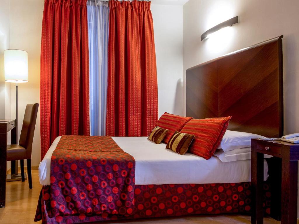 Postel nebo postele na pokoji v ubytování Hotel Ariston