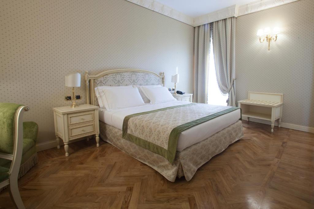 Postel nebo postele na pokoji v ubytování Hotel Marconi