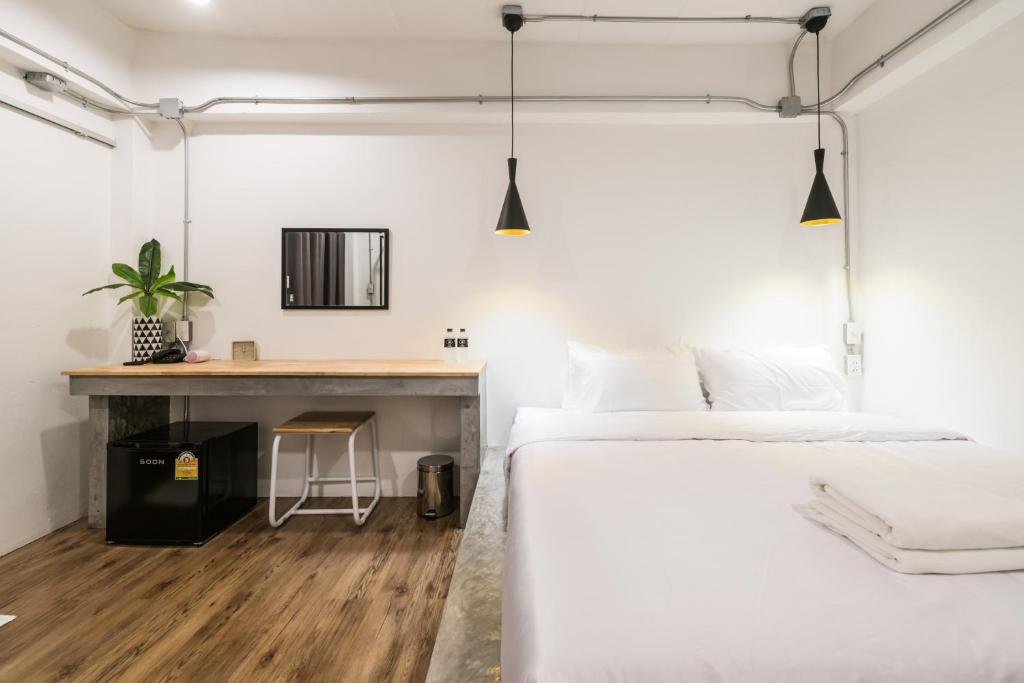 Postel nebo postele na pokoji v ubytování Your Space Hotel Prasingh