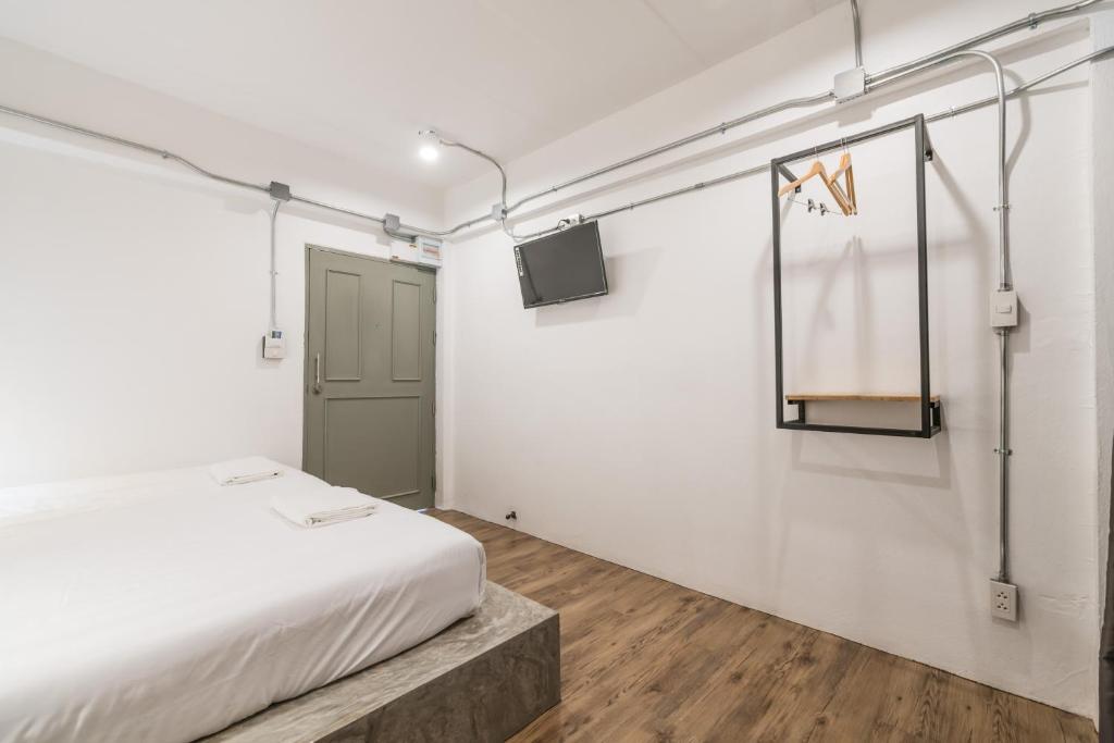 Postel nebo postele na pokoji v ubytování Your Space Hotel Prasingh