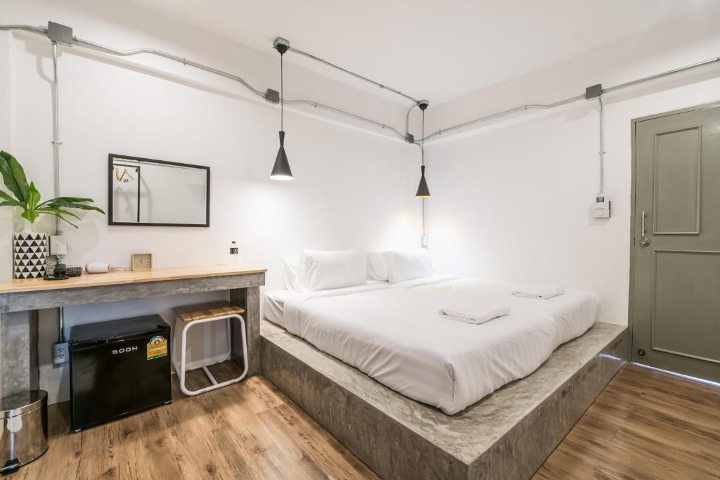 Postel nebo postele na pokoji v ubytování Your Space Hotel Prasingh