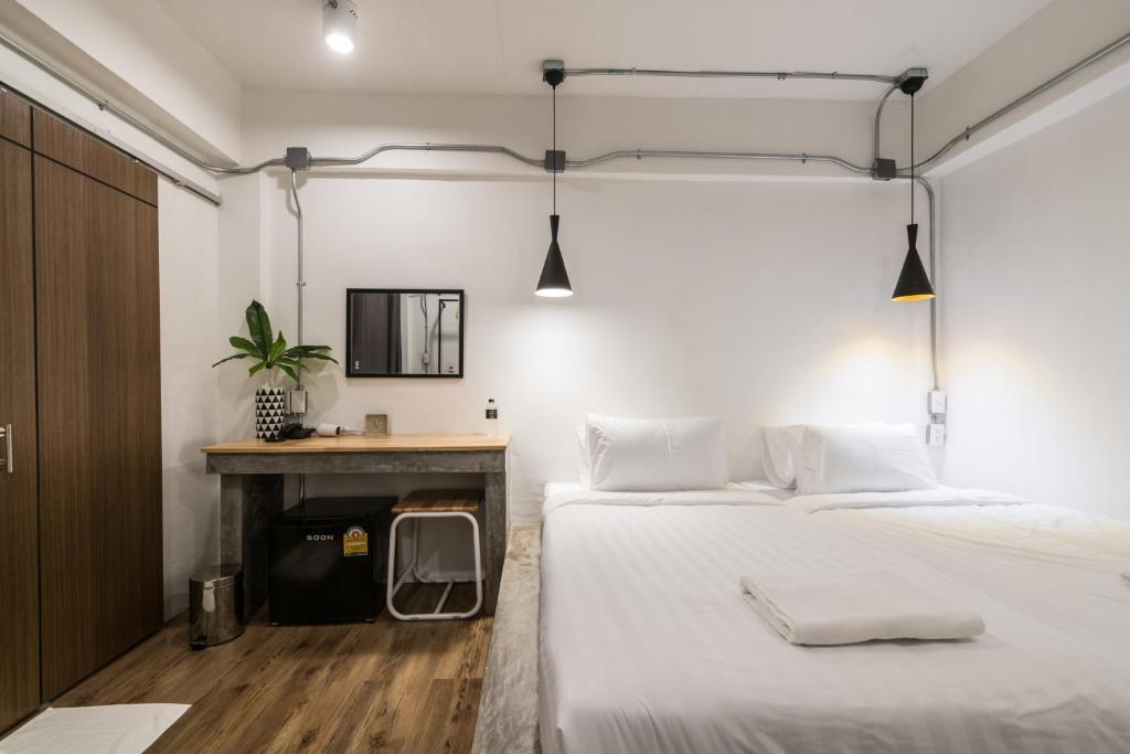 Postel nebo postele na pokoji v ubytování Your Space Hotel Prasingh