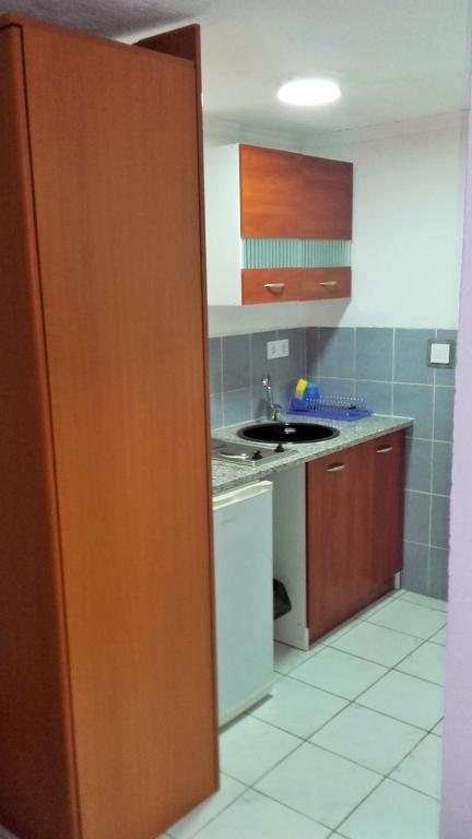 a kitchen with a sink and a counter top at Apartments Petrovic in Krimovice