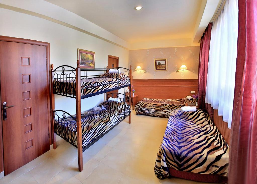 Postel nebo postele na pokoji v ubytování Hostel JUPITER
