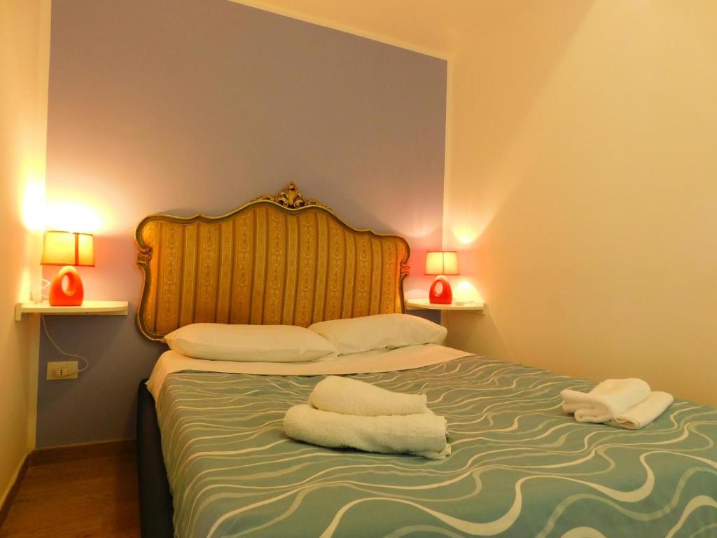 Cama o camas de una habitación en Perla del Borgo