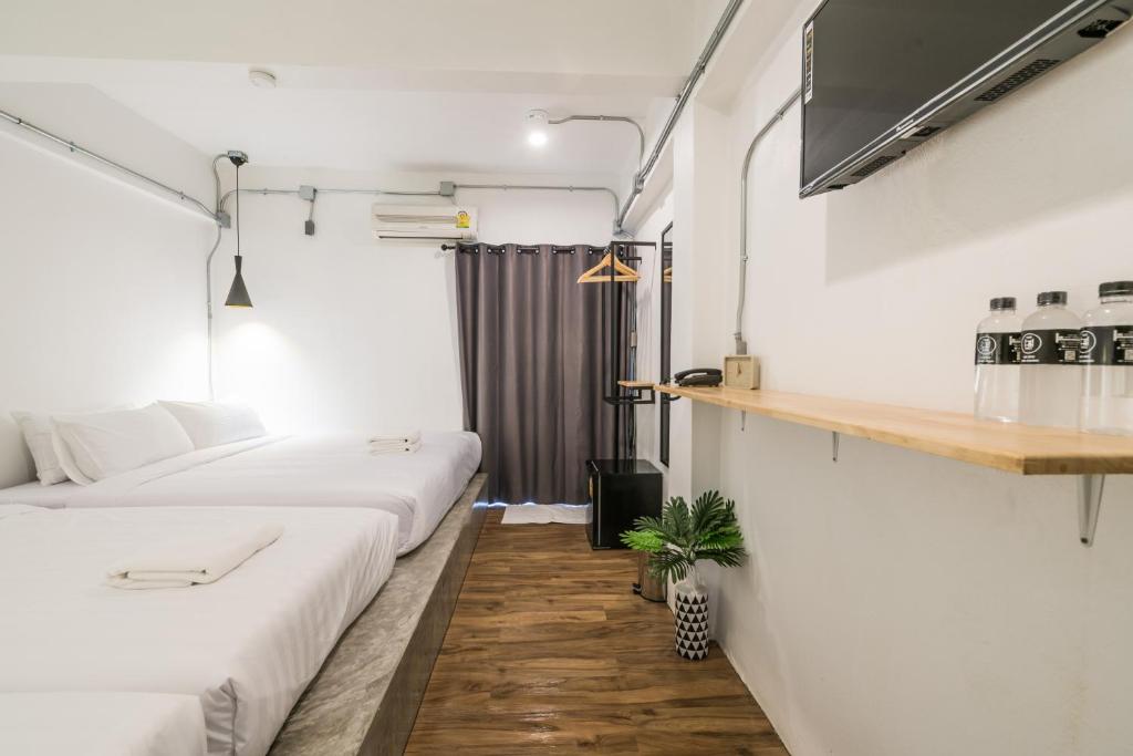 Postel nebo postele na pokoji v ubytování Your Space Hotel Prasingh