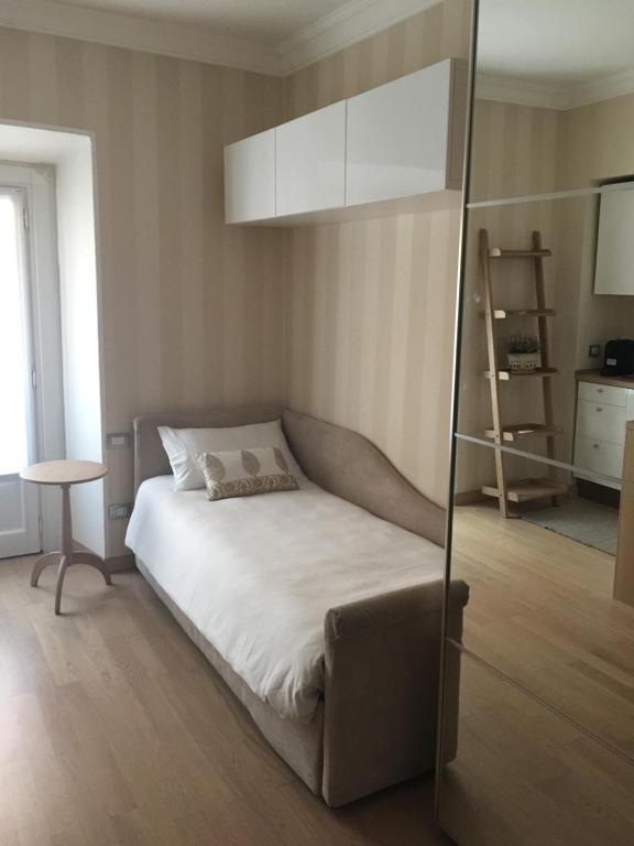 Tempat tidur dalam kamar di Appartamento Milano