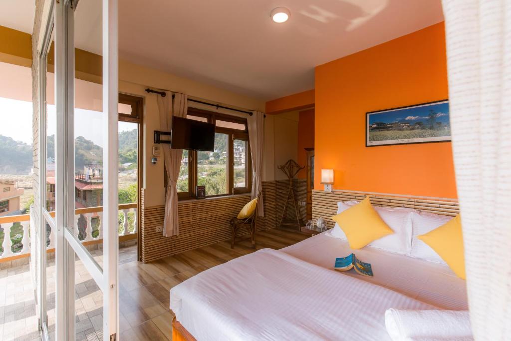 Ένα ή περισσότερα κρεβάτια σε δωμάτιο στο Zostel Pokhara