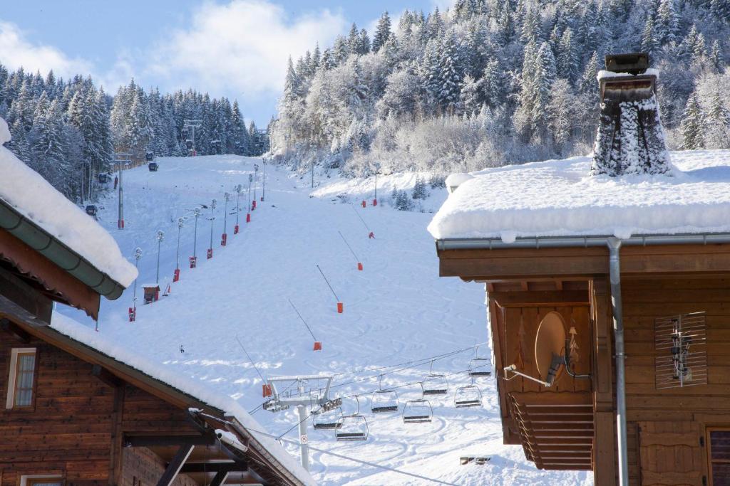 a snow covered ski slope with a ski lift at Simply Morzine - Chalet Carving in Morzine