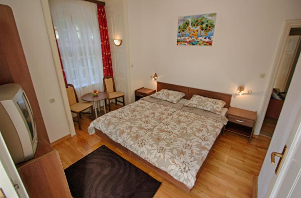 Postel nebo postele na pokoji v ubytování Rosemary Apartments & Rooms