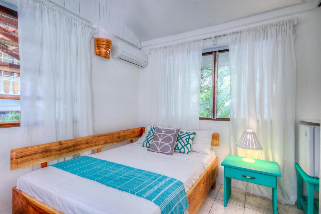 Postel nebo postele na pokoji v ubytování Hotel Guiones