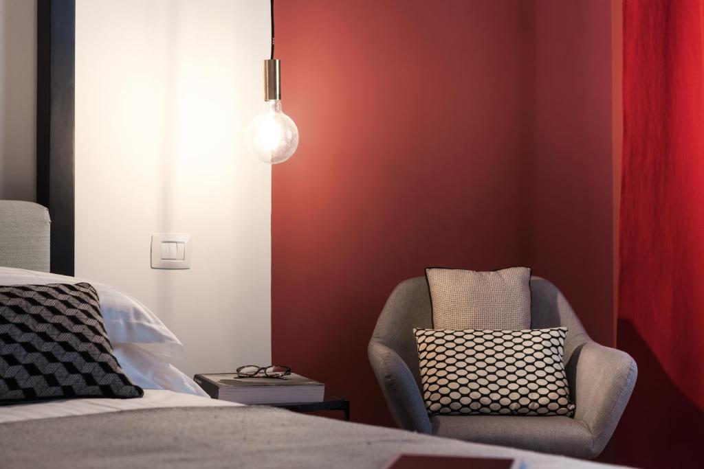 Postel nebo postele na pokoji v ubytování B&B Lorena Suites