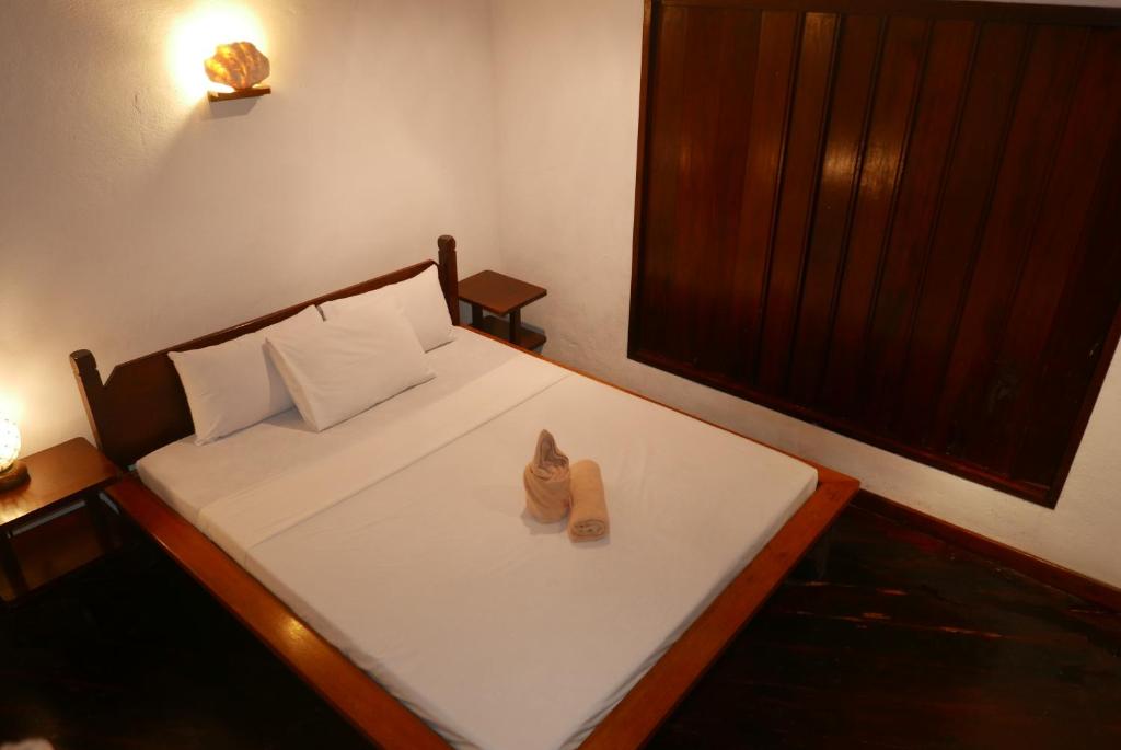 Postel nebo postele na pokoji v ubytování Dolarog Beach Resort