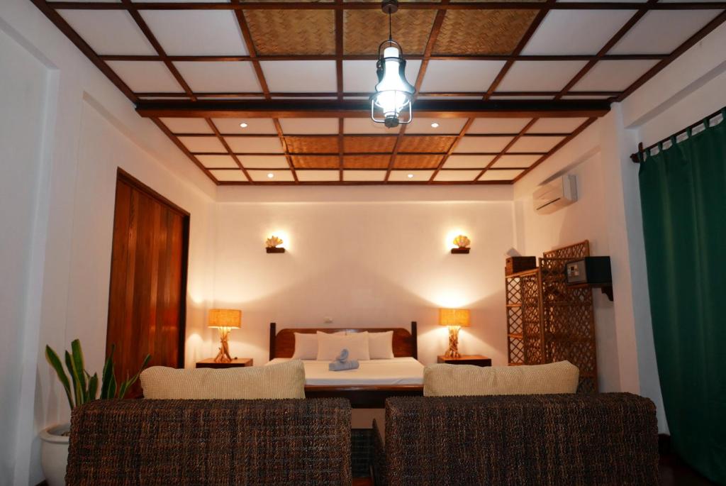 Postel nebo postele na pokoji v ubytování Dolarog Beach Resort