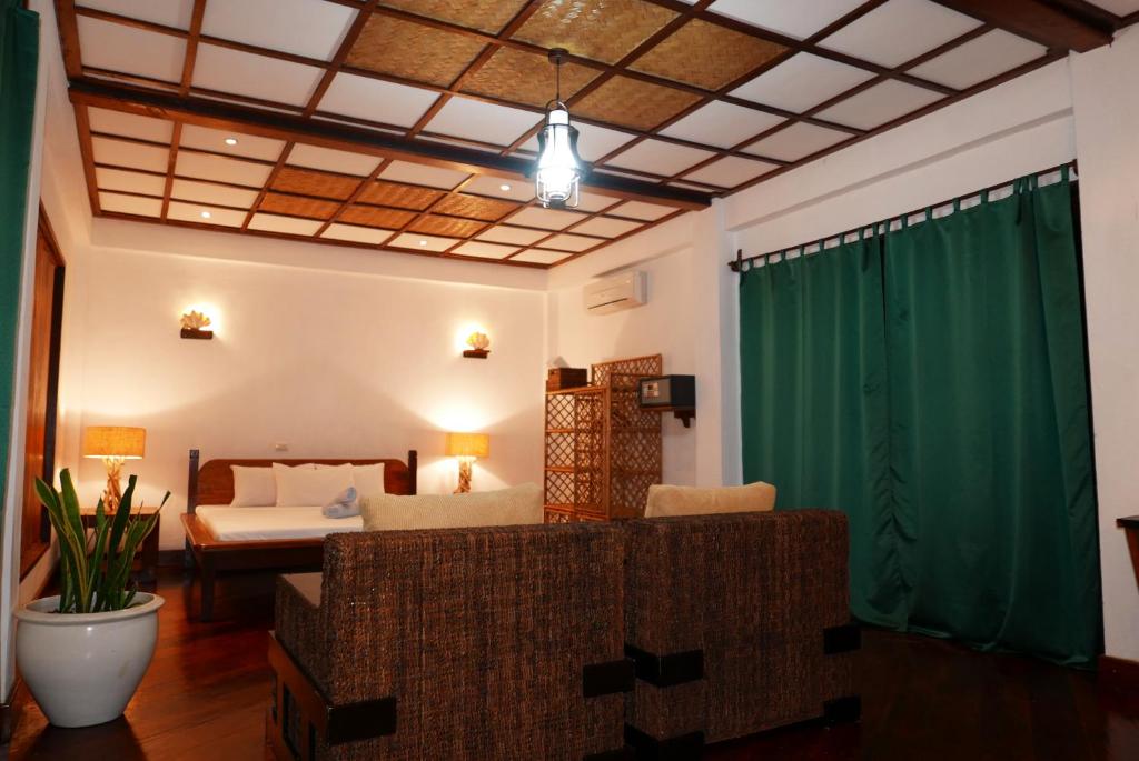 Postel nebo postele na pokoji v ubytování Dolarog Beach Resort