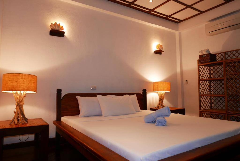 Postel nebo postele na pokoji v ubytování Dolarog Beach Resort
