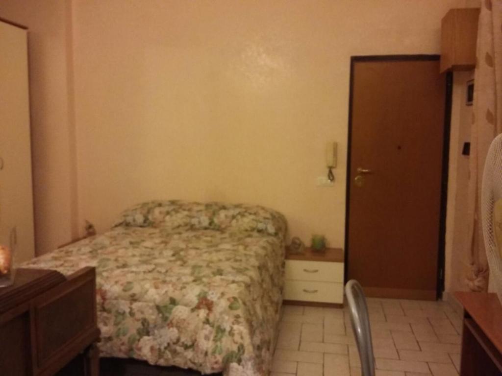A bed or beds in a room at Monolocale Monteverde