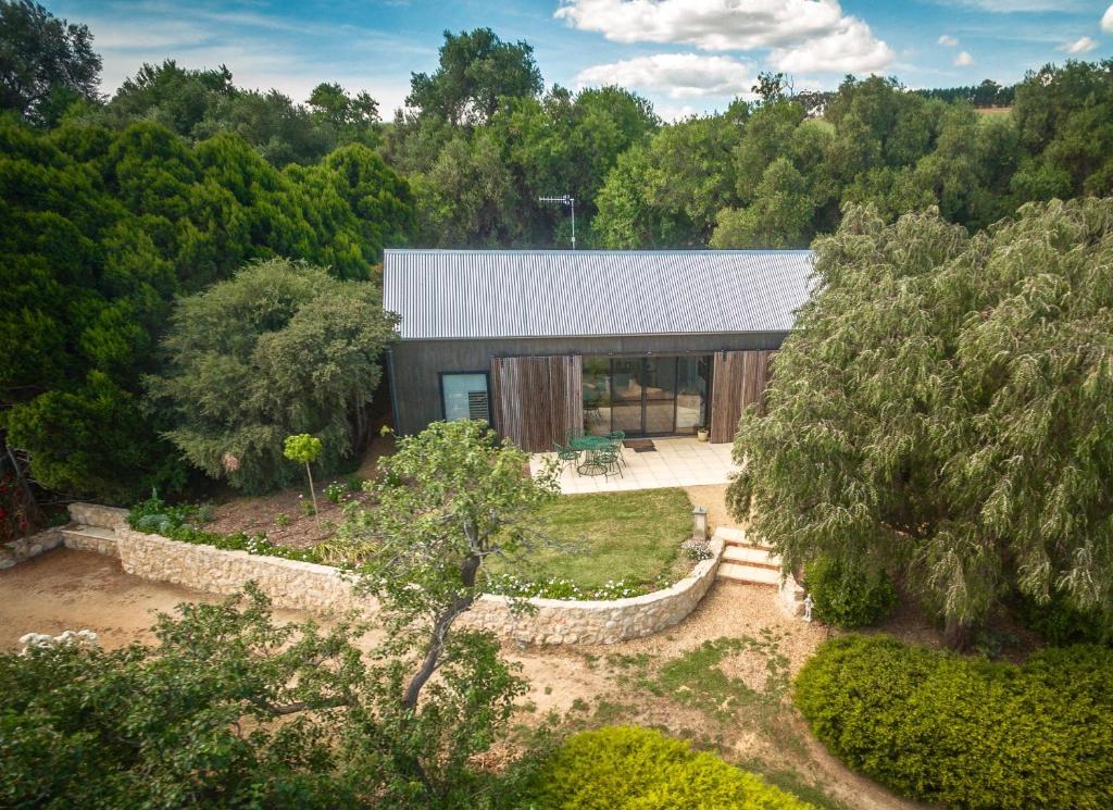 an aerial view of a house in the woods at The Garden Cottage at The Olives in Yankalilla