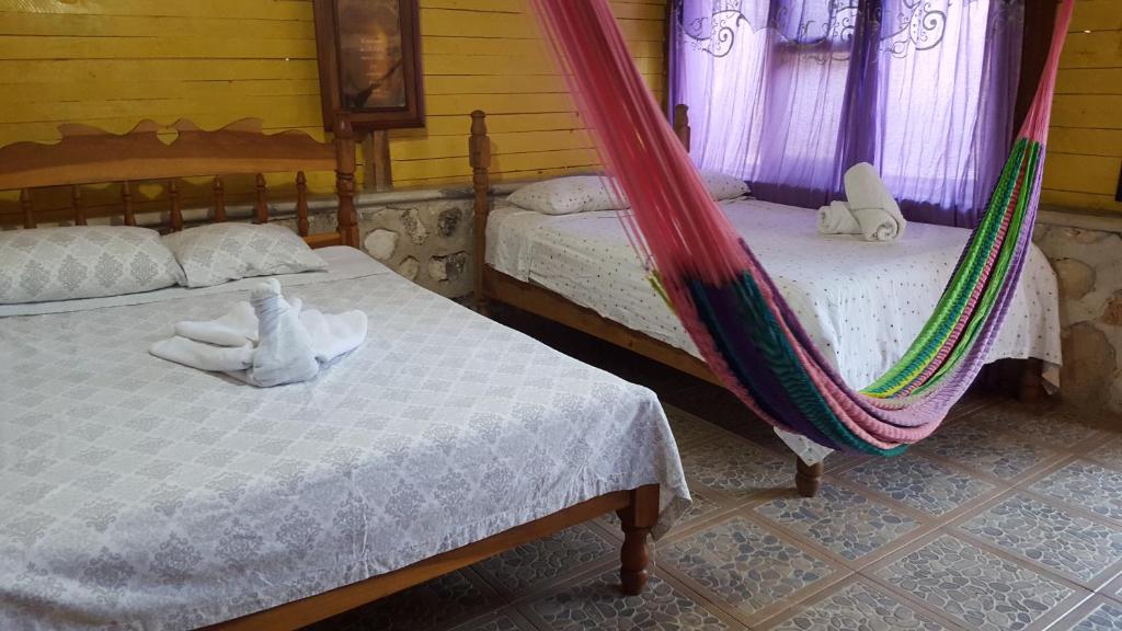 Postel nebo postele na pokoji v ubytování Posada los Reyecitos